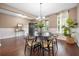 Stylish dining area with a round table, contemporary decor, and ample natural light at 145 Basket Grass Ln, Summerville, SC 29486