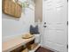 Cozy entryway with built-in bench, hat, bag, decor, and a coat rack next to the door at 145 Basket Grass Ln, Summerville, SC 29486