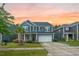 Exterior view of a two-story home with blue siding, a well-kept lawn, and a two-car garage at 145 Basket Grass Ln, Summerville, SC 29486