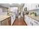 Modern kitchen with stainless steel appliances, white cabinets, and granite countertops, offering functionality and style at 145 Basket Grass Ln, Summerville, SC 29486
