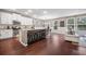 Bright kitchen features white cabinets, granite countertops, a large island with seating, and modern stainless steel appliances at 145 Basket Grass Ln, Summerville, SC 29486