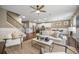 Beautiful living room with hardwood floors, stairs, modern furnishings, and an open layout to the kitchen at 145 Basket Grass Ln, Summerville, SC 29486