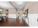 Open floor plan showcases the dark wood flooring and wainscoting in the living room at 145 Basket Grass Ln, Summerville, SC 29486
