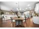 Open-concept living space flows seamlessly from the kitchen and dining area into a comfortable living area at 145 Basket Grass Ln, Summerville, SC 29486