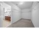 Walk-in closet with carpet and wire shelving and access to a bathroom at 145 Basket Grass Ln, Summerville, SC 29486