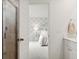 Bright bathroom showing shower and bedroom view; the design creates a harmonious and inviting space at 153 Threaded Fern St, Summerville, SC 29485