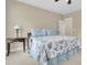 Bedroom featuring a covered bed, bedside table with lamp, and light neutral walls at 1531 Capel St, Mount Pleasant, SC 29466
