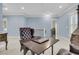 Bonus room with blue walls, a chess table, and a dark wood cabinet at 1531 Capel St, Mount Pleasant, SC 29466