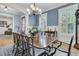 Elegant dining room boasts natural light, fresh paint, classic wainscoting, and ample seating for entertaining at 1531 Capel St, Mount Pleasant, SC 29466