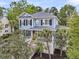 Beautiful two-story home with a charming front porch and well-maintained landscaping at 1531 Capel St, Mount Pleasant, SC 29466