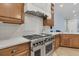 Modern kitchen featuring stainless steel appliances, quartz countertops, and tiled backsplash at 1531 Capel St, Mount Pleasant, SC 29466