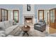 Inviting living room featuring a fireplace, comfortable seating, and natural light from the windows at 1531 Capel St, Mount Pleasant, SC 29466