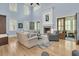 Spacious living room featuring a fireplace, comfortable seating, and large windows for natural light at 1531 Capel St, Mount Pleasant, SC 29466