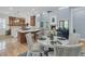 Open-concept kitchen, dining, and living area featuring hardwood floors and natural light at 1531 Capel St, Mount Pleasant, SC 29466