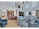 Open-concept living room with high ceilings, hardwood floors, and a view of the kitchen area at 1531 Capel St, Mount Pleasant, SC 29466
