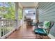 Cozy porch with outdoor seating, a gas grill, and lush greenery offers a relaxing outdoor space at 1531 Capel St, Mount Pleasant, SC 29466