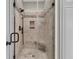 Beautiful tiled shower with glass door, rainfall shower head and built-in niche at 1531 Capel St, Mount Pleasant, SC 29466