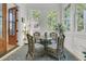 Cozy sun room features wicker seating, natural light, and tranquil view at 1531 Capel St, Mount Pleasant, SC 29466