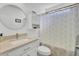 Bathroom featuring a vanity with a round mirror, a toilet, and a shower with a patterned curtain at 157 Tyger St, Summerville, SC 29485