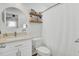 Clean, white bathroom with vanity, round mirror, and shower/tub combo with curtain at 157 Tyger St, Summerville, SC 29485