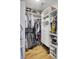 Organized walk-in closet with shelving, drawers, and hanging space for clothes and accessories at 157 Tyger St, Summerville, SC 29485