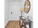 Bright foyer featuring hardwood floors, a console table with decor, and a welcoming atmosphere at 157 Tyger St, Summerville, SC 29485