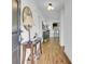 Warm entryway featuring hardwood floors, stylish console table, and open view to living spaces at 157 Tyger St, Summerville, SC 29485