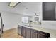 Modern kitchen featuring stainless steel appliances, sleek countertops, and dark cabinets with white subway tile backsplash at 157 Tyger St, Summerville, SC 29485