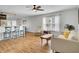 Comfortable living room with hardwood floors, a ceiling fan, and an open design to the kitchen at 157 Tyger St, Summerville, SC 29485