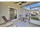 Relaxing screened-in patio with ceiling fan and grill area for outdoor entertaining at 157 Tyger St, Summerville, SC 29485