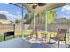 Inviting screened patio with seating area for outdoor relaxation and enjoyment at 157 Tyger St, Summerville, SC 29485