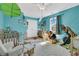 Bright bedroom featuring fun decor, a crib, a comfy chair, and a window view at 1595 Teal Marsh Rd, Charleston, SC 29412
