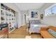 Bedroom featuring a day bed, orange sofa, built-in shelving and a window to allow natural light to flow at 1595 Teal Marsh Rd, Charleston, SC 29412