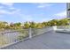 Spacious deck offering breathtaking views of the adjacent lake and surrounding greenery at 1595 Teal Marsh Rd, Charleston, SC 29412