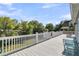 Large deck overlooking well-maintained lawn and offering lovely views of the lush backyard at 1595 Teal Marsh Rd, Charleston, SC 29412