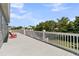 Spacious deck featuring white railings and ample space for outdoor enjoyment and entertaining at 1595 Teal Marsh Rd, Charleston, SC 29412