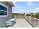 Inviting deck with outdoor seating offering tranquil views of the surrounding landscape at 1595 Teal Marsh Rd, Charleston, SC 29412