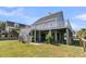 Home's exterior shows elevated living, a covered patio, with multiple levels of outdoor stairs at 1595 Teal Marsh Rd, Charleston, SC 29412