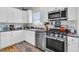 Well-equipped kitchen with stainless steel appliances, granite countertops, and stylish finishes at 1595 Teal Marsh Rd, Charleston, SC 29412