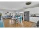 Spacious living space with hardwood floors, connecting the living room, dining area, and kitchen at 1595 Teal Marsh Rd, Charleston, SC 29412