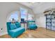 Cozy sitting area with arched windows, comfortable chairs, and plenty of natural light at 1595 Teal Marsh Rd, Charleston, SC 29412