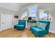 Inviting sitting area with arched windows, comfortable chairs, and ample natural light at 1595 Teal Marsh Rd, Charleston, SC 29412