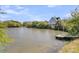 Breathtaking view of the lake, showcasing a home with a private dock at 1595 Teal Marsh Rd, Charleston, SC 29412