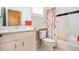 Bright, tiled bathroom with ample cabinet space and a shower-tub combination, designed for comfort and convenience at 1615 Chatelain Way, Mount Pleasant, SC 29464