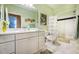 Bathroom with an expansive vanity and a shower/tub featuring stylish black accent tiles and neutral colors at 1615 Chatelain Way, Mount Pleasant, SC 29464