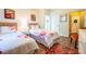 Inviting bedroom with two beds, hardwood flooring, and a sunny ambiance, perfect for relaxing at 1615 Chatelain Way, Mount Pleasant, SC 29464