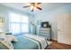 Calming bedroom with blue accents, including a ceiling fan for comfort and soft, natural light at 1615 Chatelain Way, Mount Pleasant, SC 29464