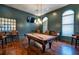 This game room features a billiards table, bar stools, and big screen tv for relaxation and fun at 1615 Chatelain Way, Mount Pleasant, SC 29464
