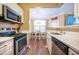 Well-equipped kitchen with stainless steel appliances and a view into the adjacent dining area at 1615 Chatelain Way, Mount Pleasant, SC 29464