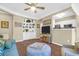 Cozy living room with built-in shelving, comfortable seating, and modern appliances in an open layout at 1615 Chatelain Way, Mount Pleasant, SC 29464